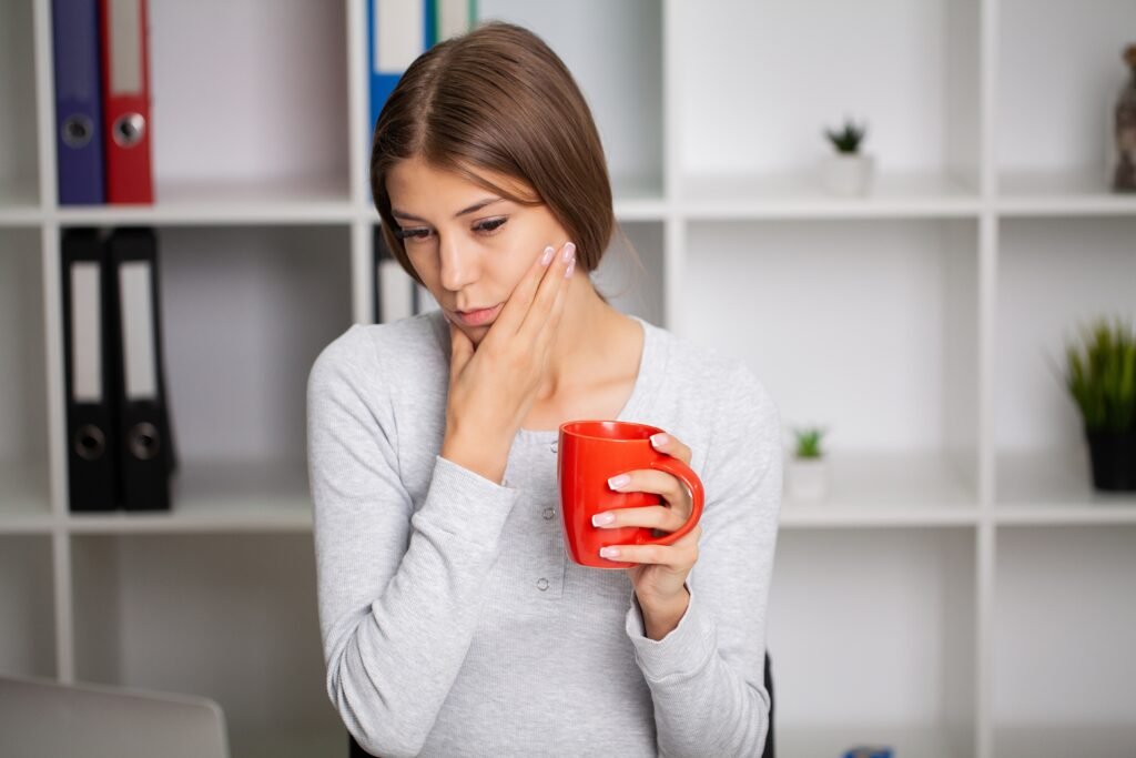 Beautiful,Exhausted,Woman,In,The,Office,Suffering,From,Severe,Toothache