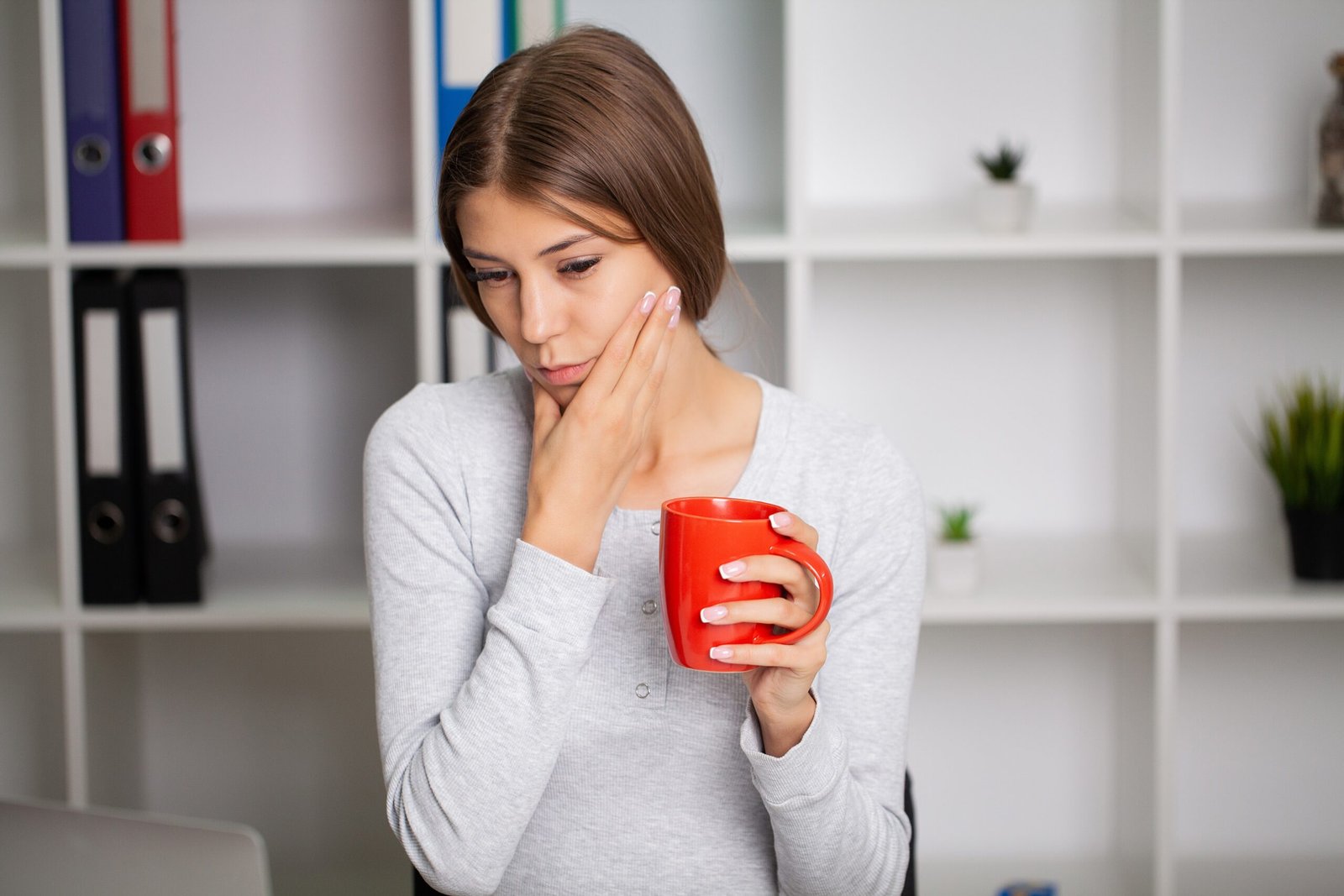 Beautiful,Exhausted,Woman,In,The,Office,Suffering,From,Severe,Toothache